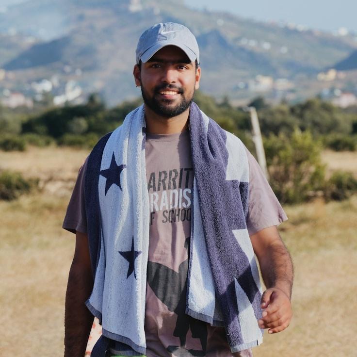 Kaveri Mehta, Lead Design Curator at Orchard Glide Lane, reviewing corporate floral arrangements